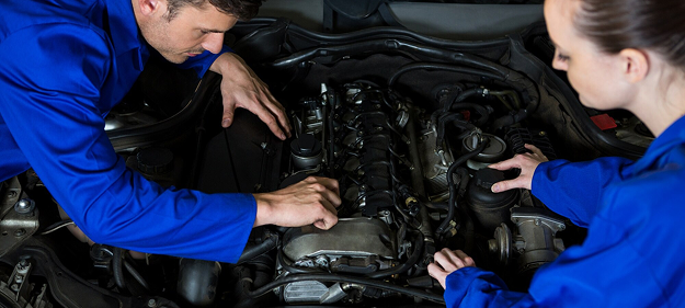 mechanics-examining-car-engine_1170-1542 1